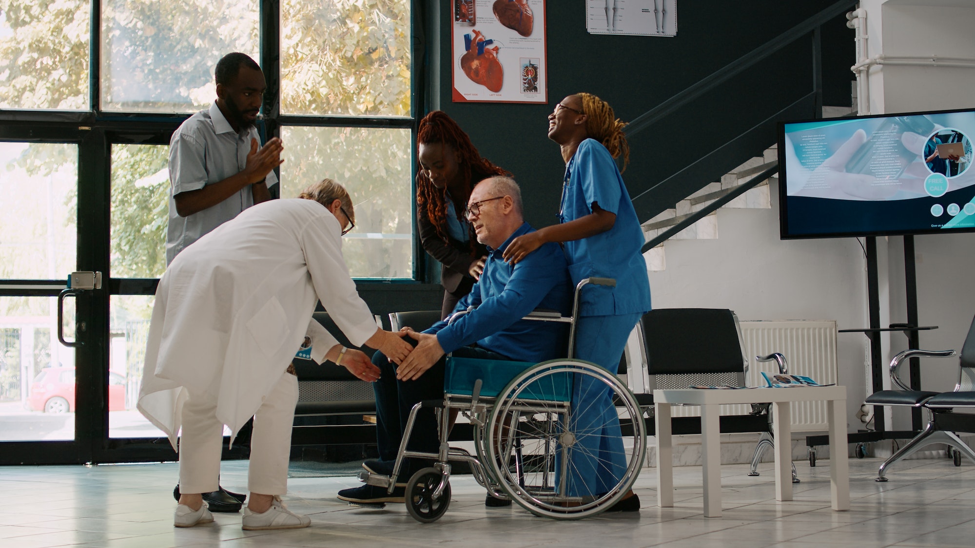 Young man and woman helping old adult to attend checkup consultation